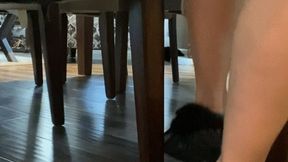 Feet under chair- removing Moccasins