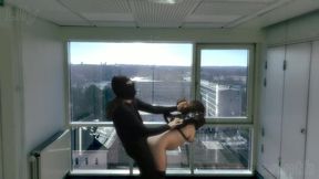 Pregnant MILF in straitjacket fucked doggystyle in office building