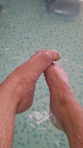 Pearl colored nail polish on wet feet