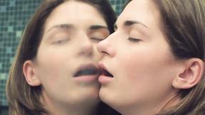 ”Hot brunette watches herself in the mirror as she masturbates”