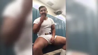 Black muscle hunk strokes his big cock in gym