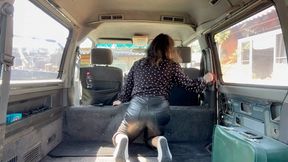 girl in leather pants cleaning her van m0