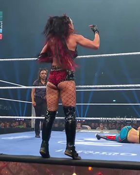 Curvy babe shows off her bubble ass in fishnet wrestling