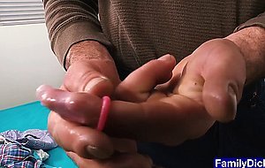 Bearded stepdad teaches stepson how to put on a condom