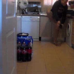 John is pissing all over the kitchen floor