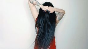 Dominatrix Nika teases with long hair while jerking off