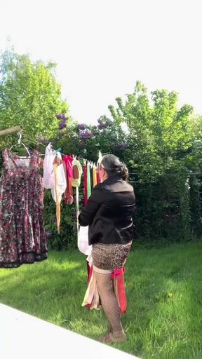 In attire with a little leopard skirt for a day and to hang the laundry.