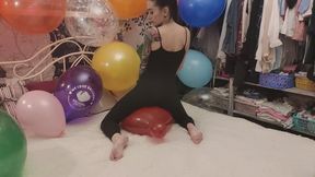 Mishel sitting on balloons