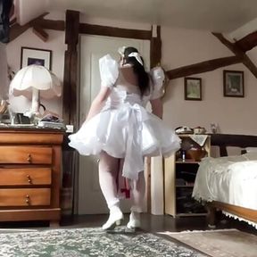 In a short wedding dress outfit to become a maid for a day