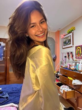 Slim Latina teen teases in a red dress