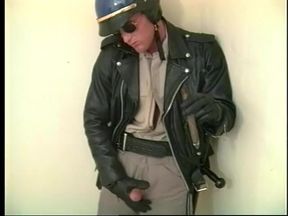 Muscular homo dude in police uniform rubs his cock till it spits cum on his hand