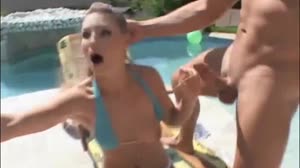 Sexy blonde gets an anal threesome by the pool