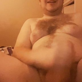 Fat guy with nipples jacks off