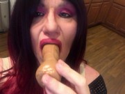 Cassie giving special attention to dildo