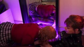 Latex shemale fisted and hammered by another one