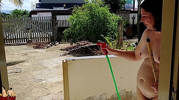 Nudist wife cleaning balcony