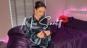 Scarlett slips into her sexy teal blouse and leather pants