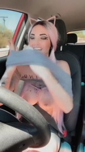 Hot tattooed girl driving around topless gets shy