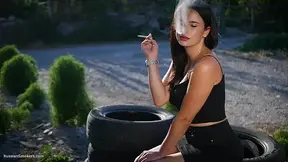 Brunette Teases Outdoors with Smoking Foreplay