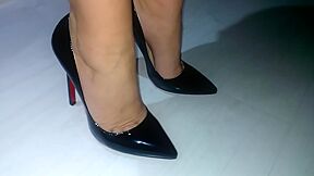Businesswoman Showing Her Feet And Legs In Expensive Pair Of Black Shoes