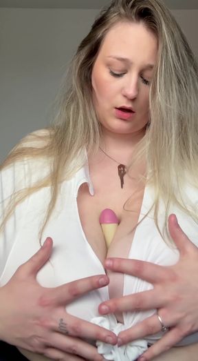 Blonde woman in white shirt holding ice cream cone