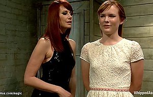 Ginger mistress whips ass to lesbian