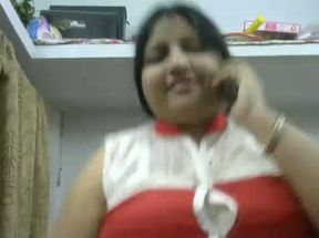 Lewd serious looking and sinful Indian brunette fatso stripteases