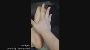 Feet Stretching Under Desk