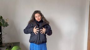 Charmy cleans her down jacket with her blue powerful vacuum m4