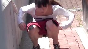 Japanese girls caught sneakily urinating in public