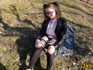 gal in glasses and jacket has sex in nature and gets a lot of cum on her face