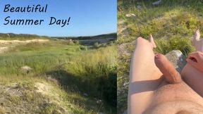 Naked boy on a stone in summer