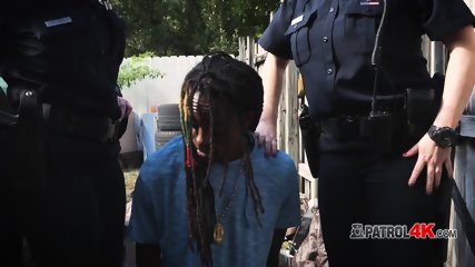 Officers arrest a criminal and subdue him into giving their pussies cock
