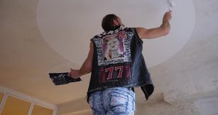 Sexy wall painter gets naked while doing his job