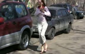 Russian brunette lady in the park makes her pants wet