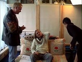 Geeky brunette seduces older stud to fuck her on the sofa