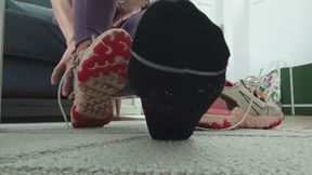 Removing sweaty trainers and socks after the gym.