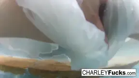 Brunette Charley masturbates and shows off her huge breasts