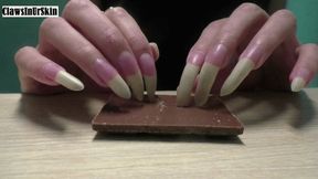 Nails scratching chocolate