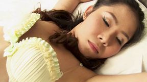 Naked Asian woman explores her pleasure with a vibrator