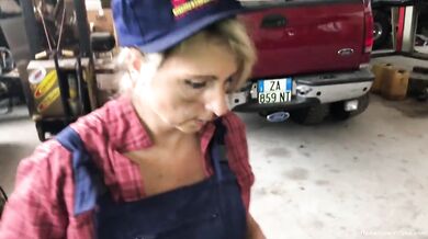 Blonde MILF sucks dark cock in messy garage point of view