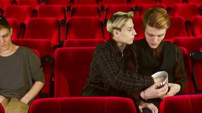 Two horny gay teens are having sex inside the cinema