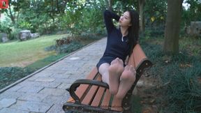 Beautiful and elegant music teacher Cai Cai wearing grey pantyhose sitting on a park bench showing off her beautiful feet and legs