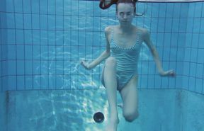 Petite white cute bitch all nude in the pool underwater