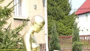 Real flexible contortionist gets golden painted