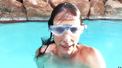 Mature brunette Sofie Marie teases her wet slit underwater in a private pool