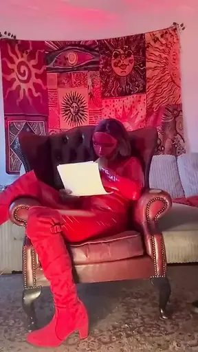 Hot babe poses in red satin outfit for cam show