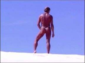 Tanned guy on beach in tiny string thong (temporarily!)