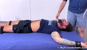 Restrained tattooed stud receives tickle tormented by dom