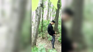 Watch as this guy's smoking cigarette catches him off guard, and he strokes his big, throbbing cock in a woods almost caught!
